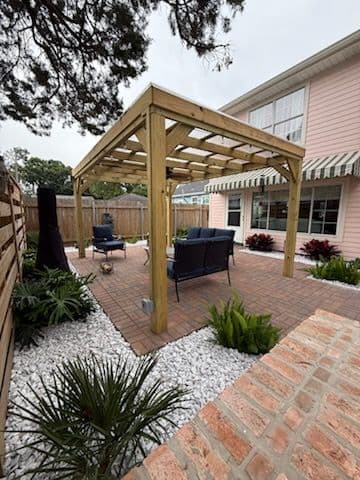 Charming Patio with Wooden Pergola in River Ridge image
